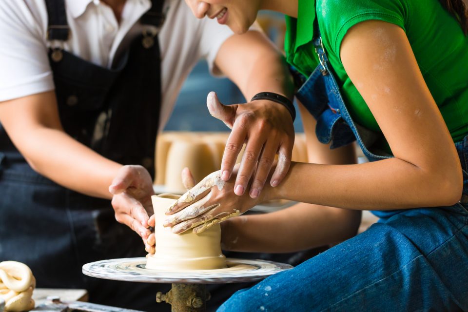 Potter creating clay bowl at Kiln and Company